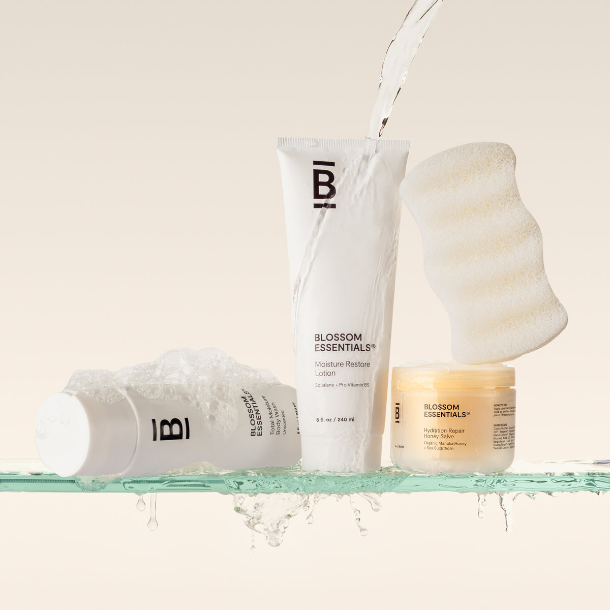 Blossom Essentials Products on a shelf getting poured on by water.