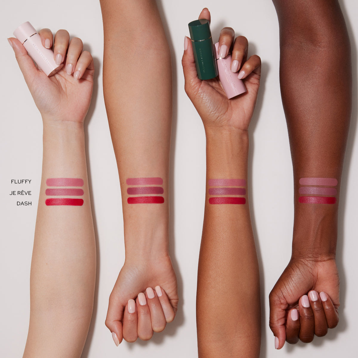 Swatches of Westman Lip trio Fluffy, Je Reve, and Dash on different shades of skin 