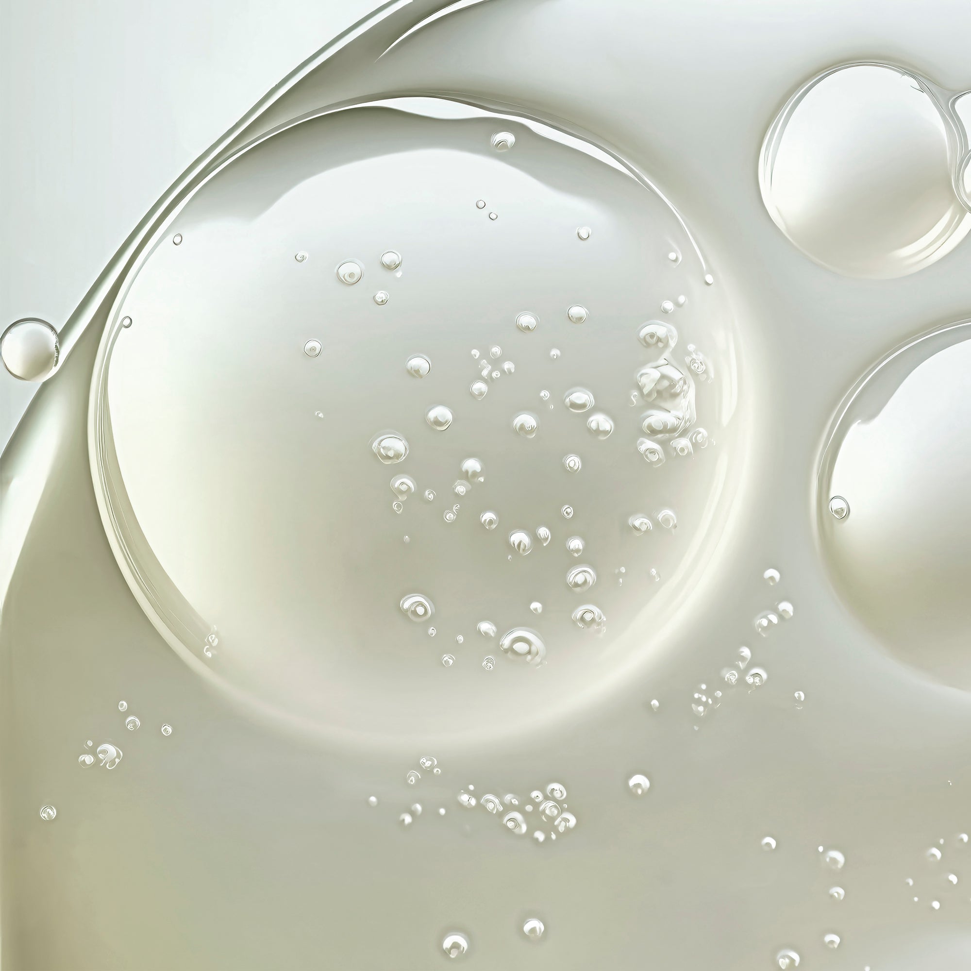 Close-up of liquid with bubbles on a light gray background