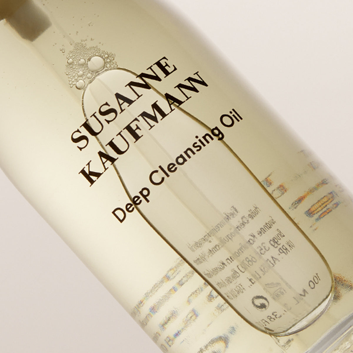 Bottle of Susanne Kaufmann Deep Cleansing Oil with visible branding and product details.