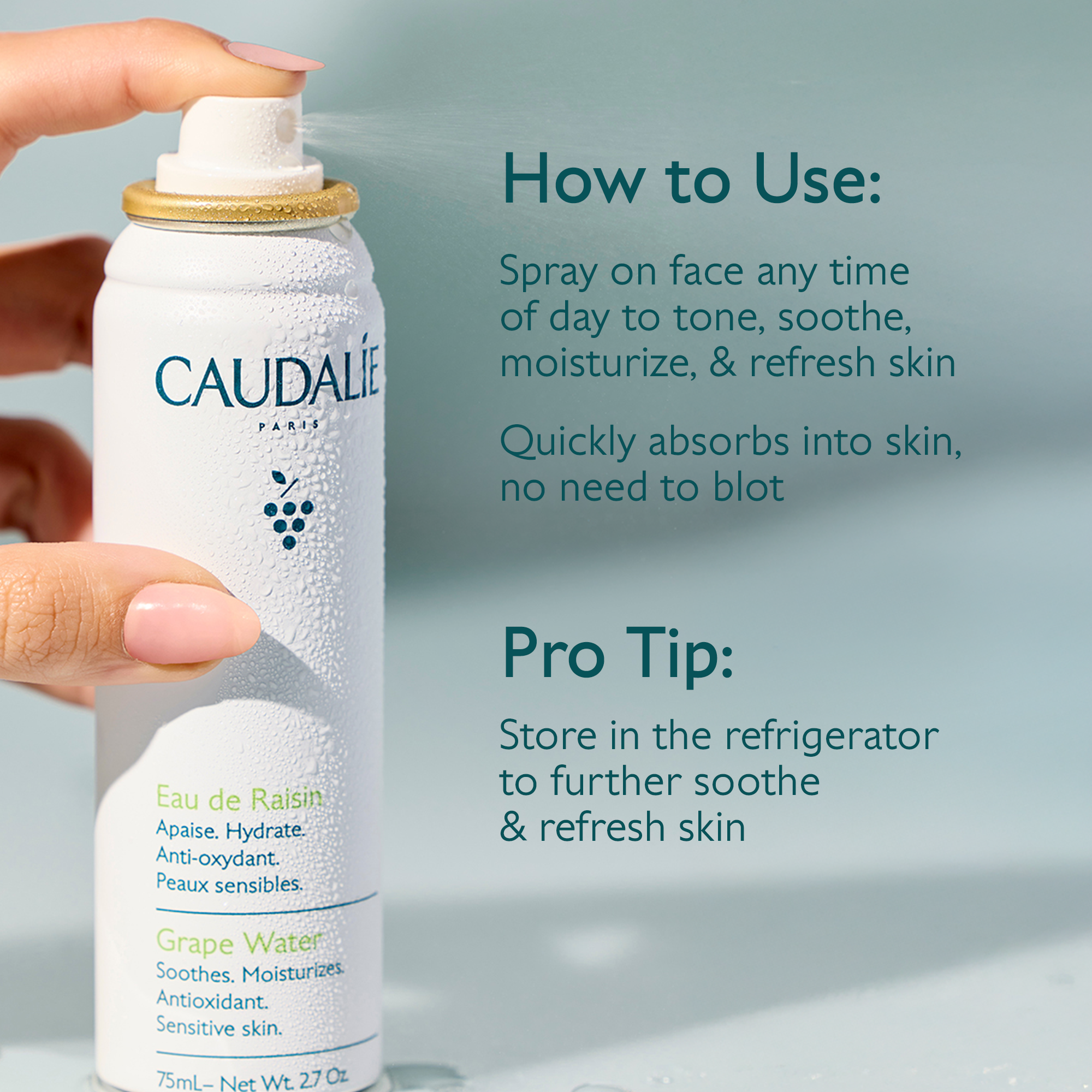 Caudalie spray bottle with usage instructions on a light blue background