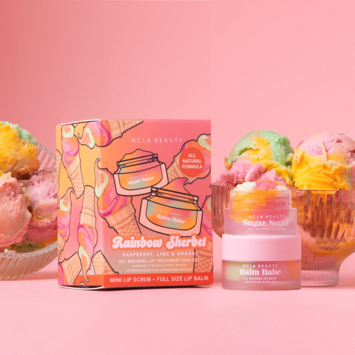 NCLA Beauty lip balm and scrub set with ice cream-themed packaging on a pink background