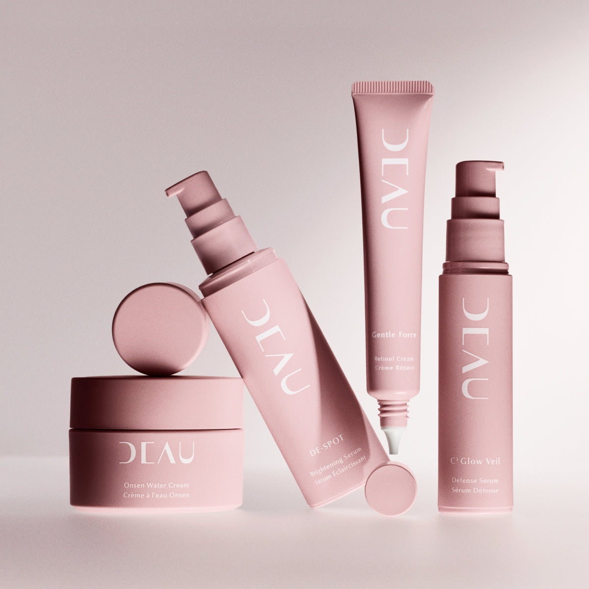 Set of OLEAU skincare products on a light pink background