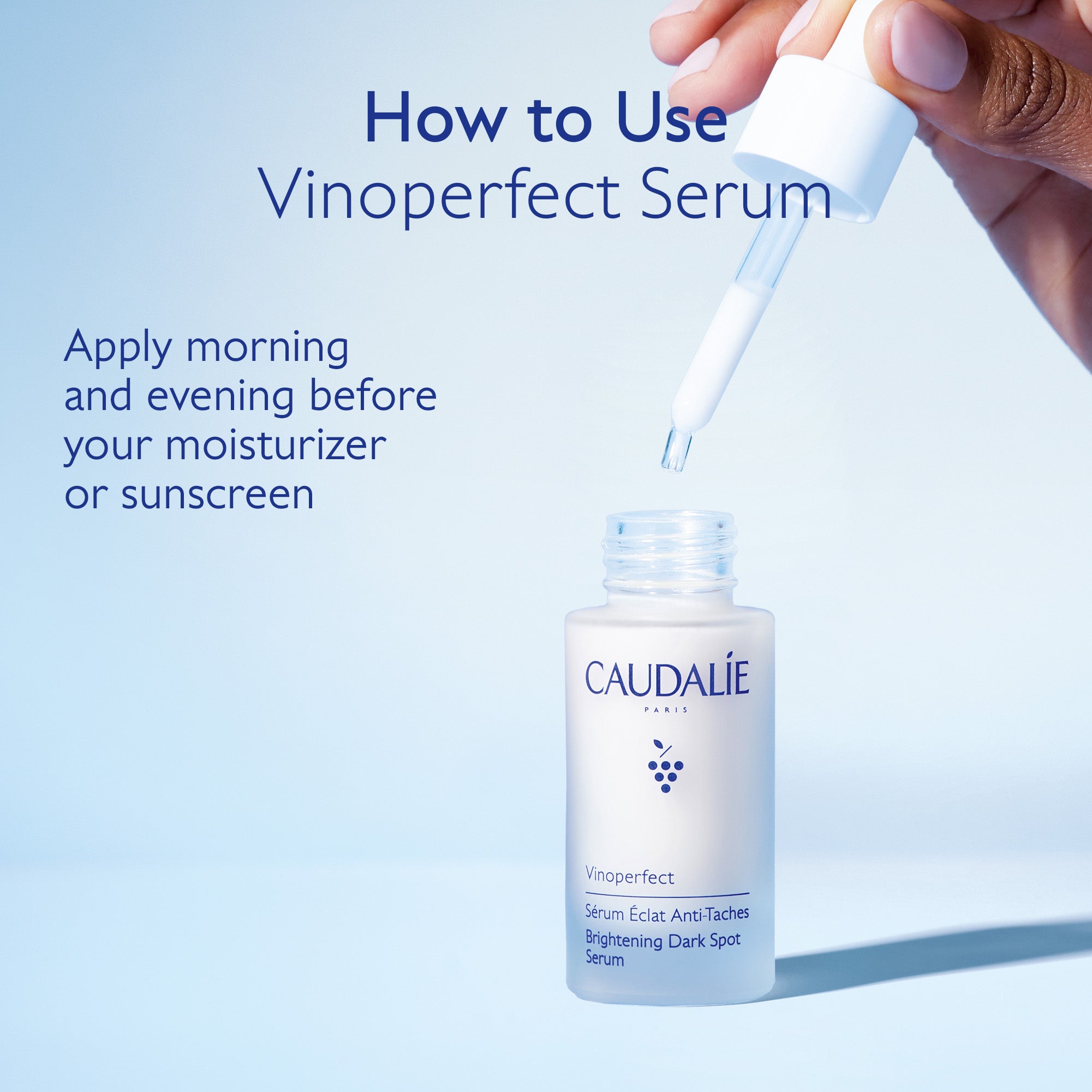 Caudalie Vinoperfect Serum with dropper on a light blue background