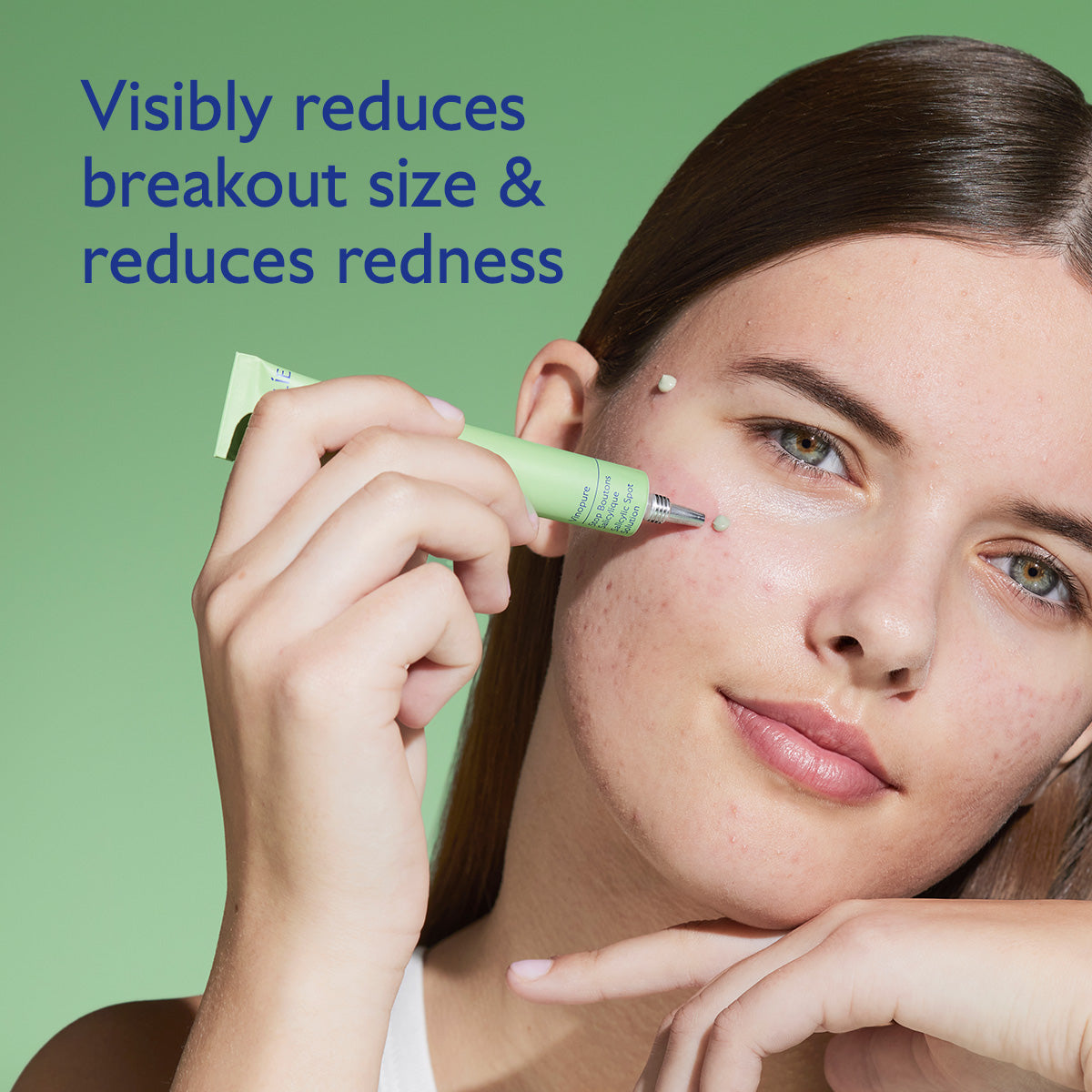 Woman applying a green skincare product to her face with text on a green background