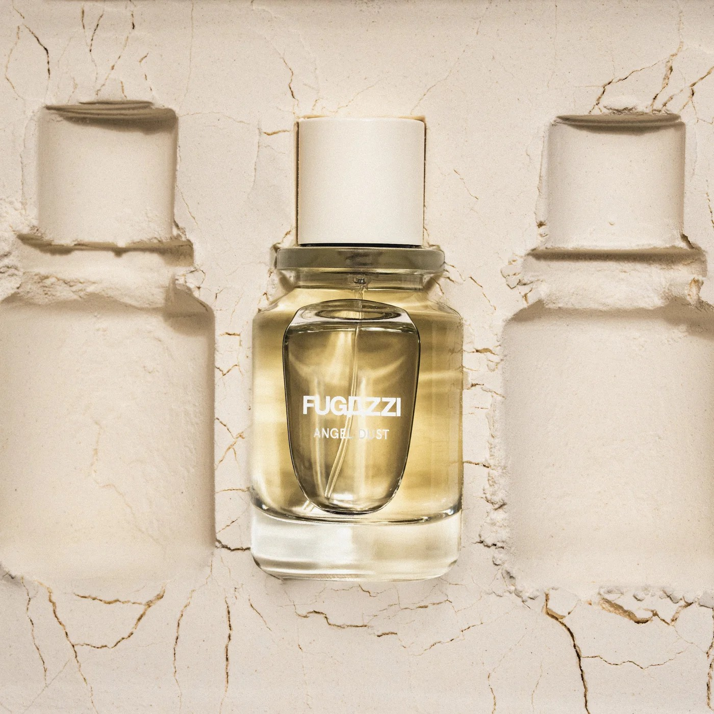 fugazzi angel dust perfume bottle  in powder with powder imprints of bottle on both sides