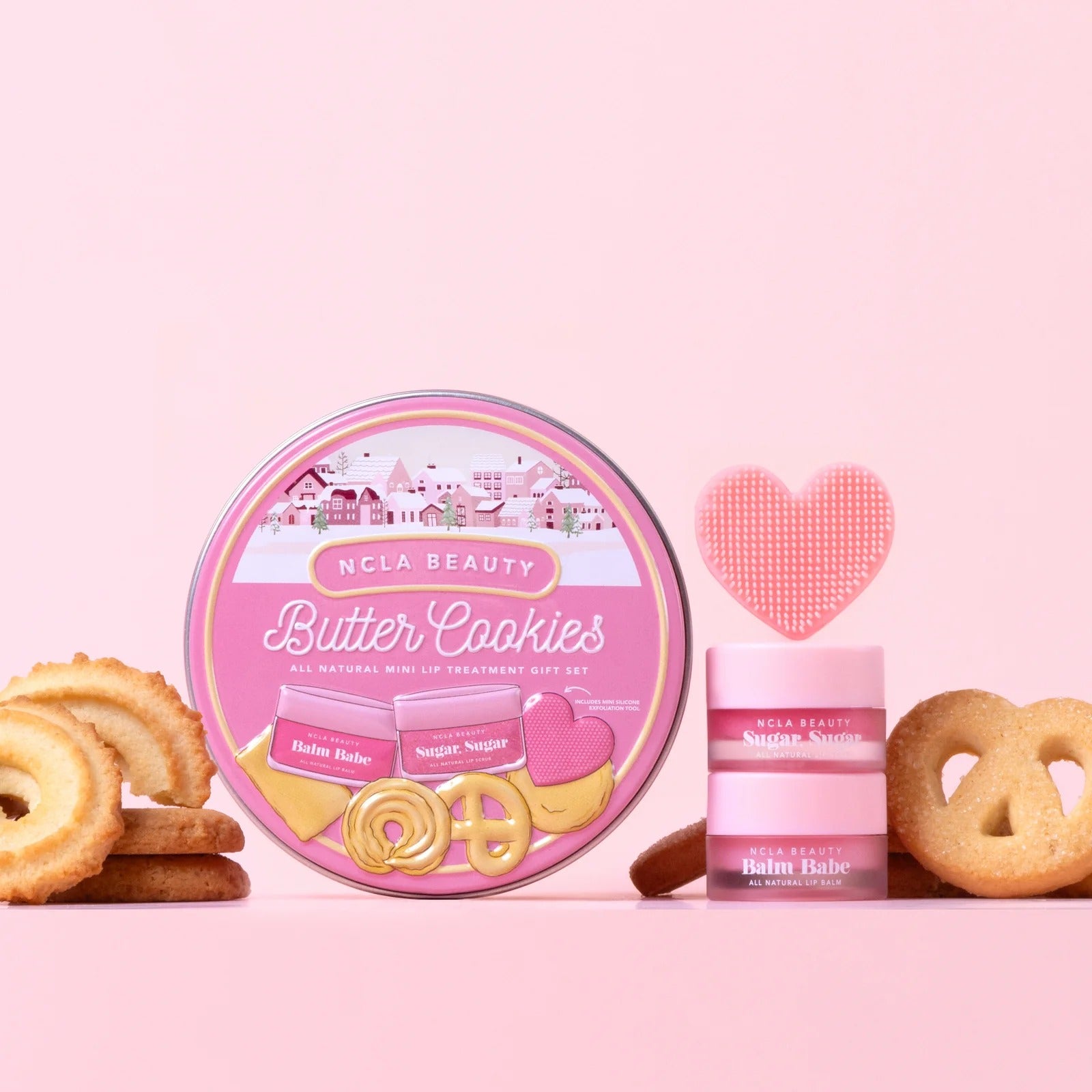 NCLA Beauty Butter Cookies product set on a pink background with cookies and a heart-shaped item.