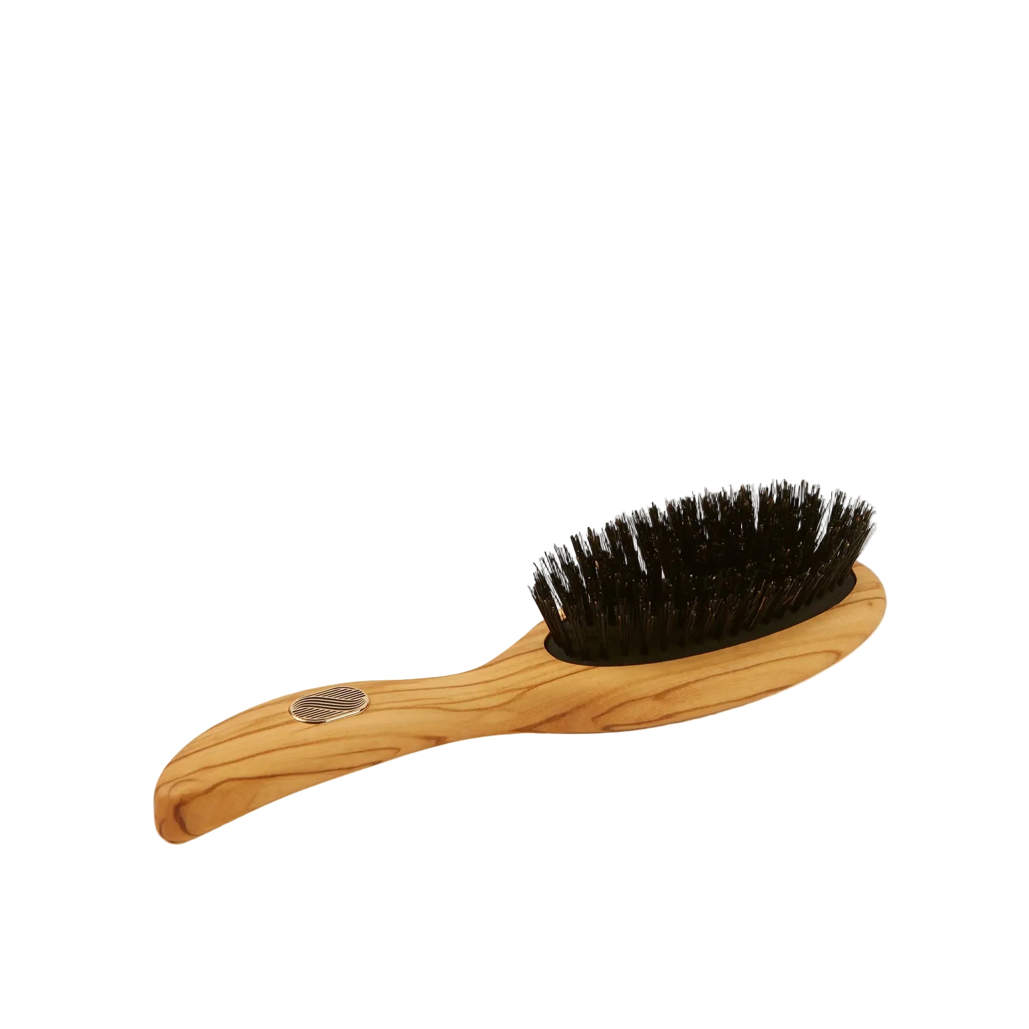 Wooden brush with black bristles on a white background
