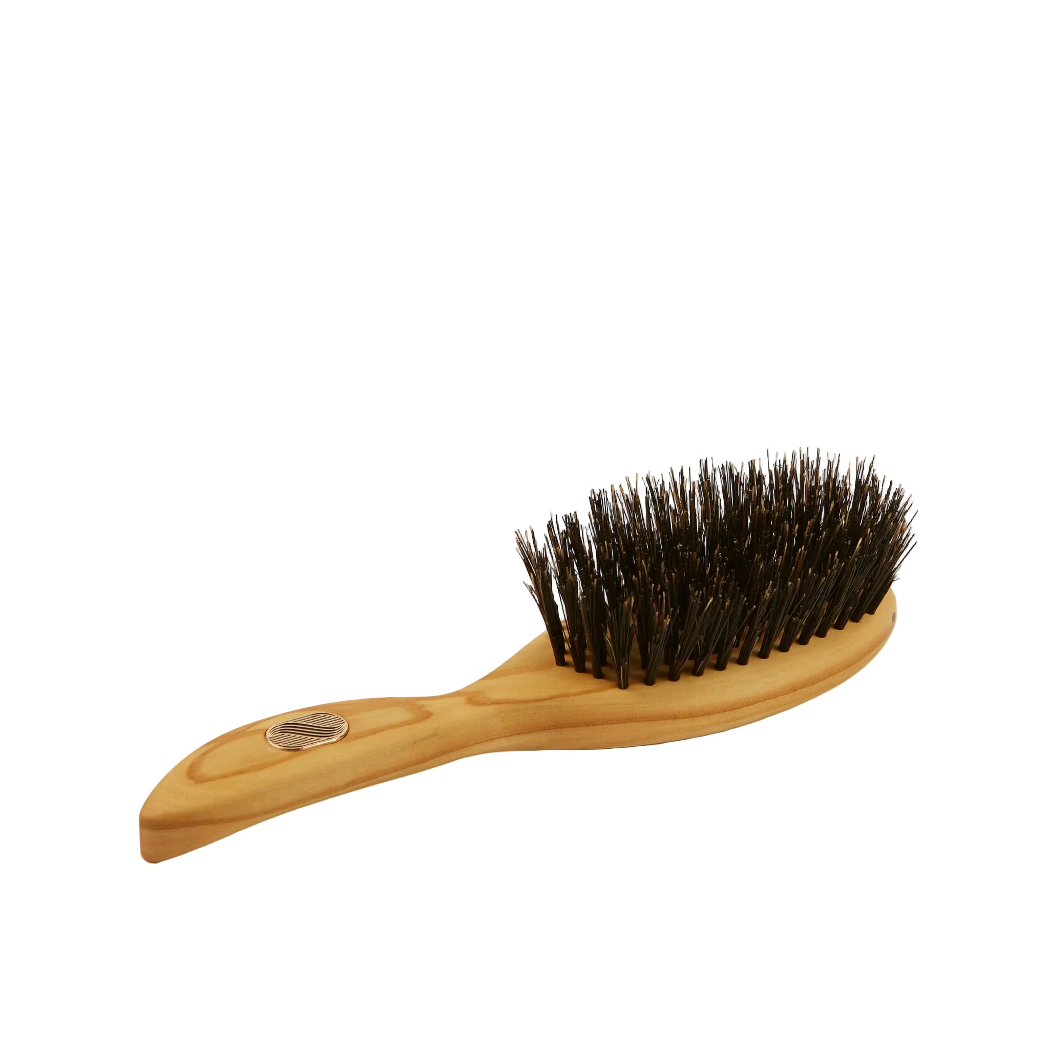 A wooden hairbrush with a light natural wood handle and dark brown bristles, shown on a plain off-white background.