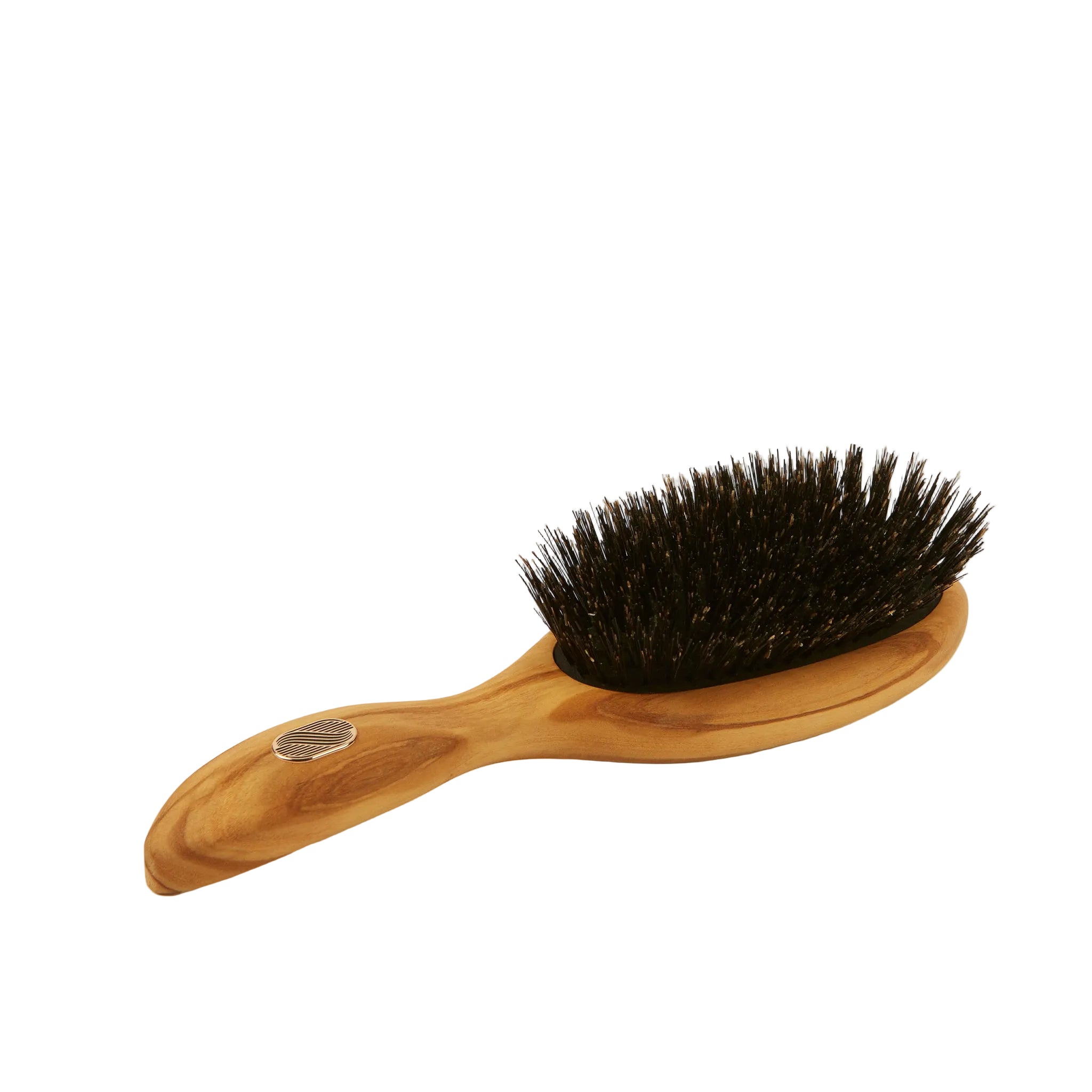 Wooden hairbrush with black bristles on a white background