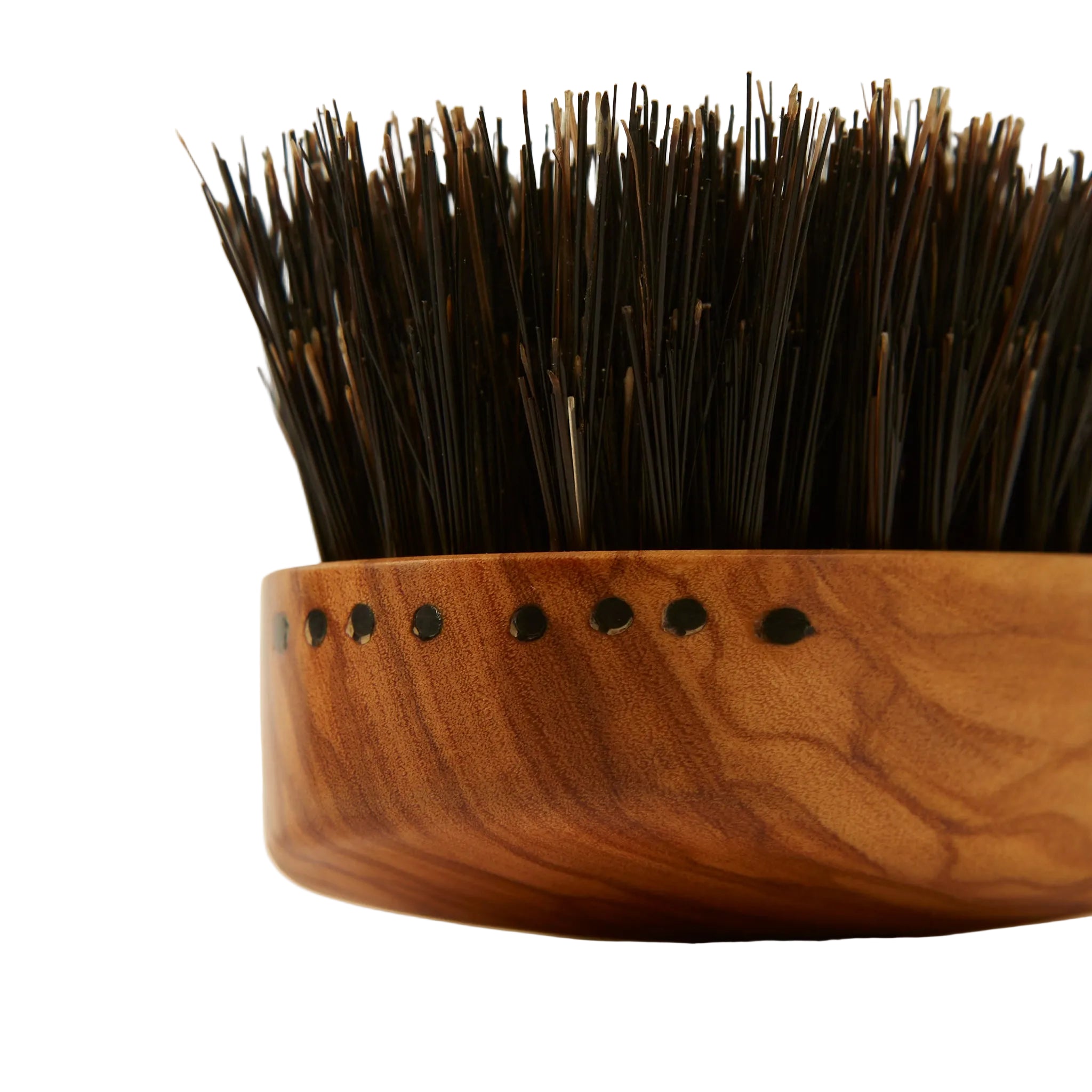 Wooden brush with bristle head on a light background
