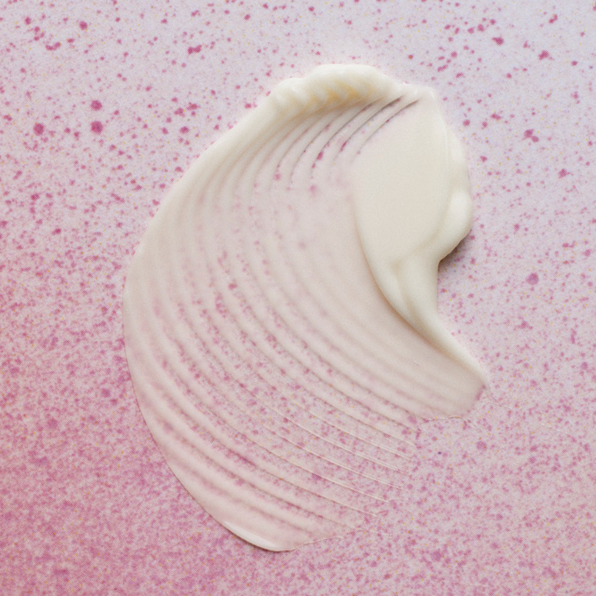 White product swatch on a pink textured background