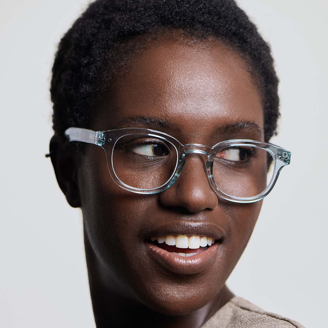 Person wearing glasses with a neutral background