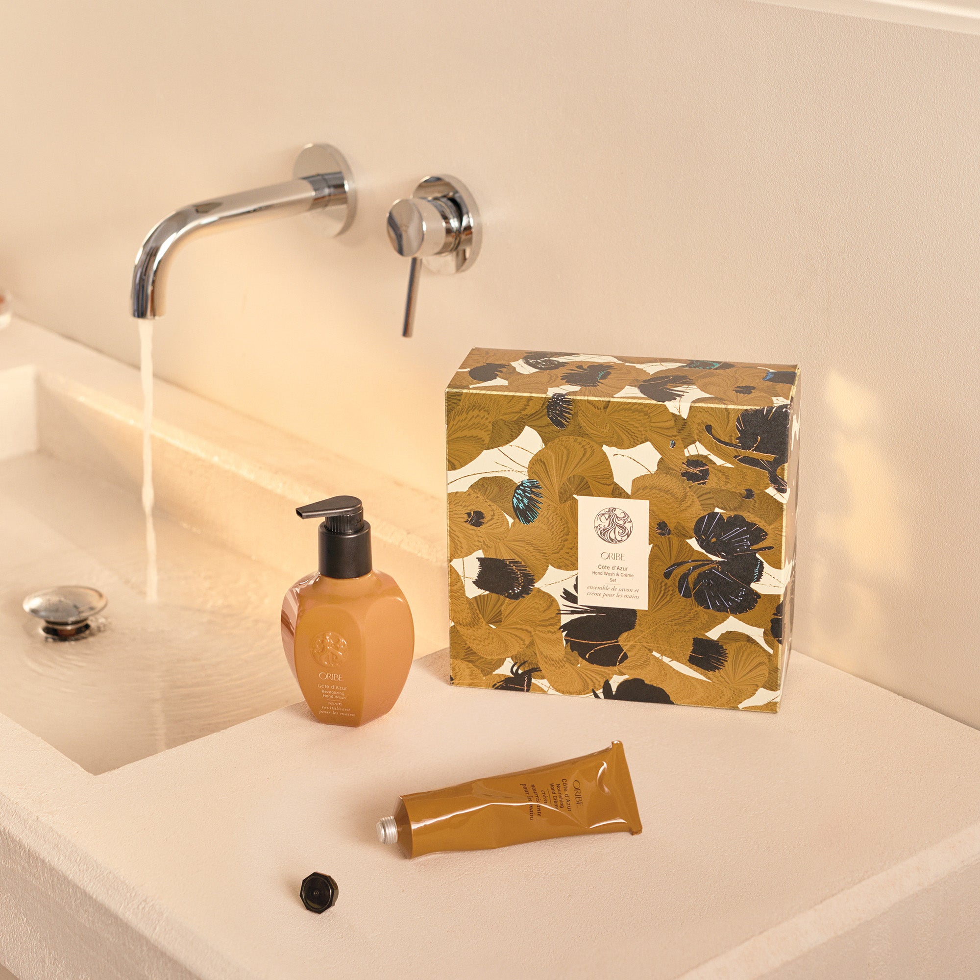 Bathroom setting with skincare products and a decorative box on a sink.