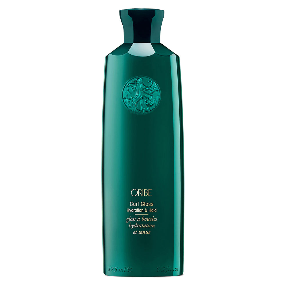 Green bottle of Oribe Curl Gloss on a white background