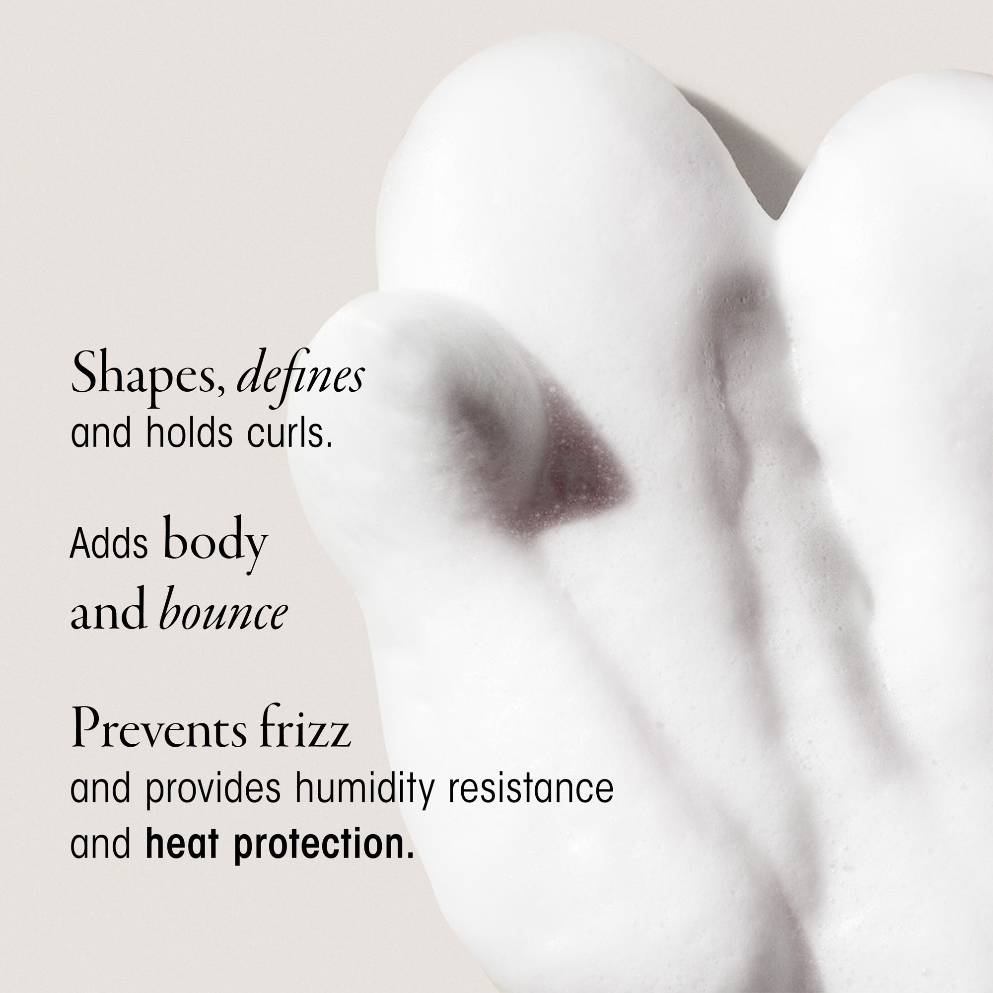 Text describing hair product features with a blurred background and a swatch of Oribe Mousse.