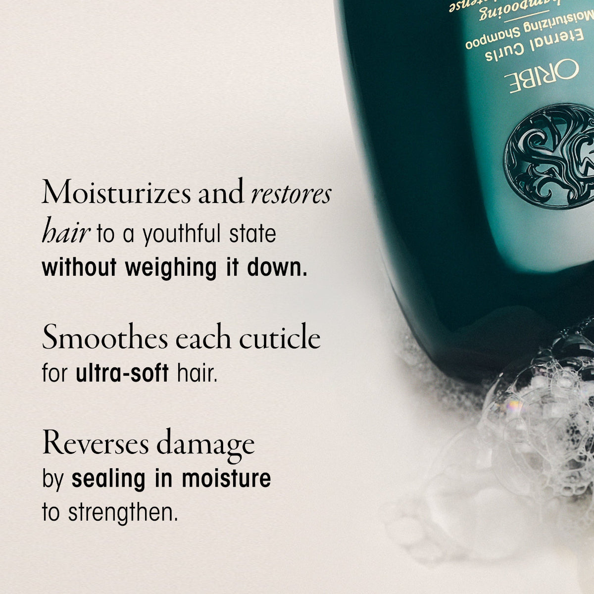 Oribe shampoo bottle with product benefits text on a light background