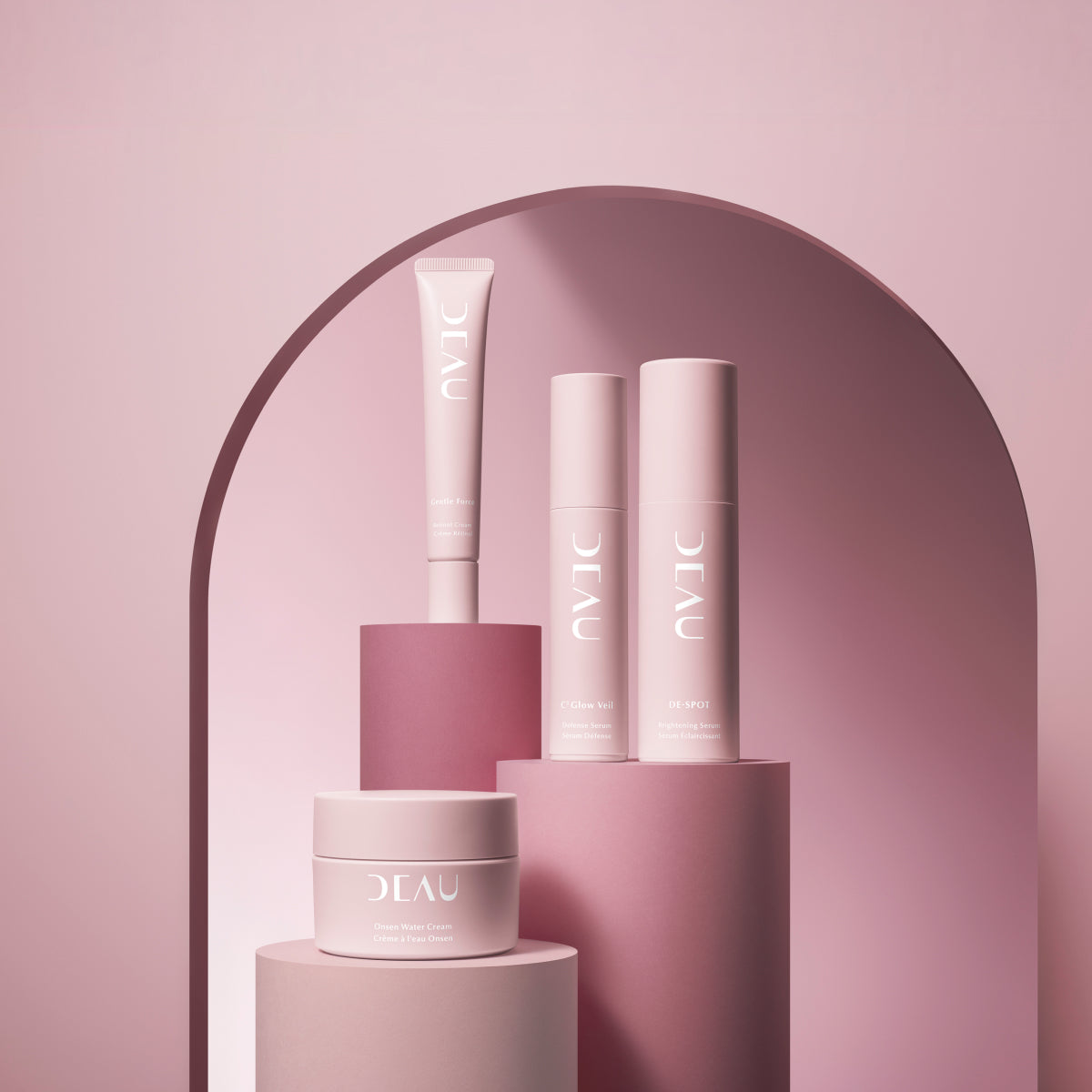Cosmetic products with 'DEAU' branding on a pink background