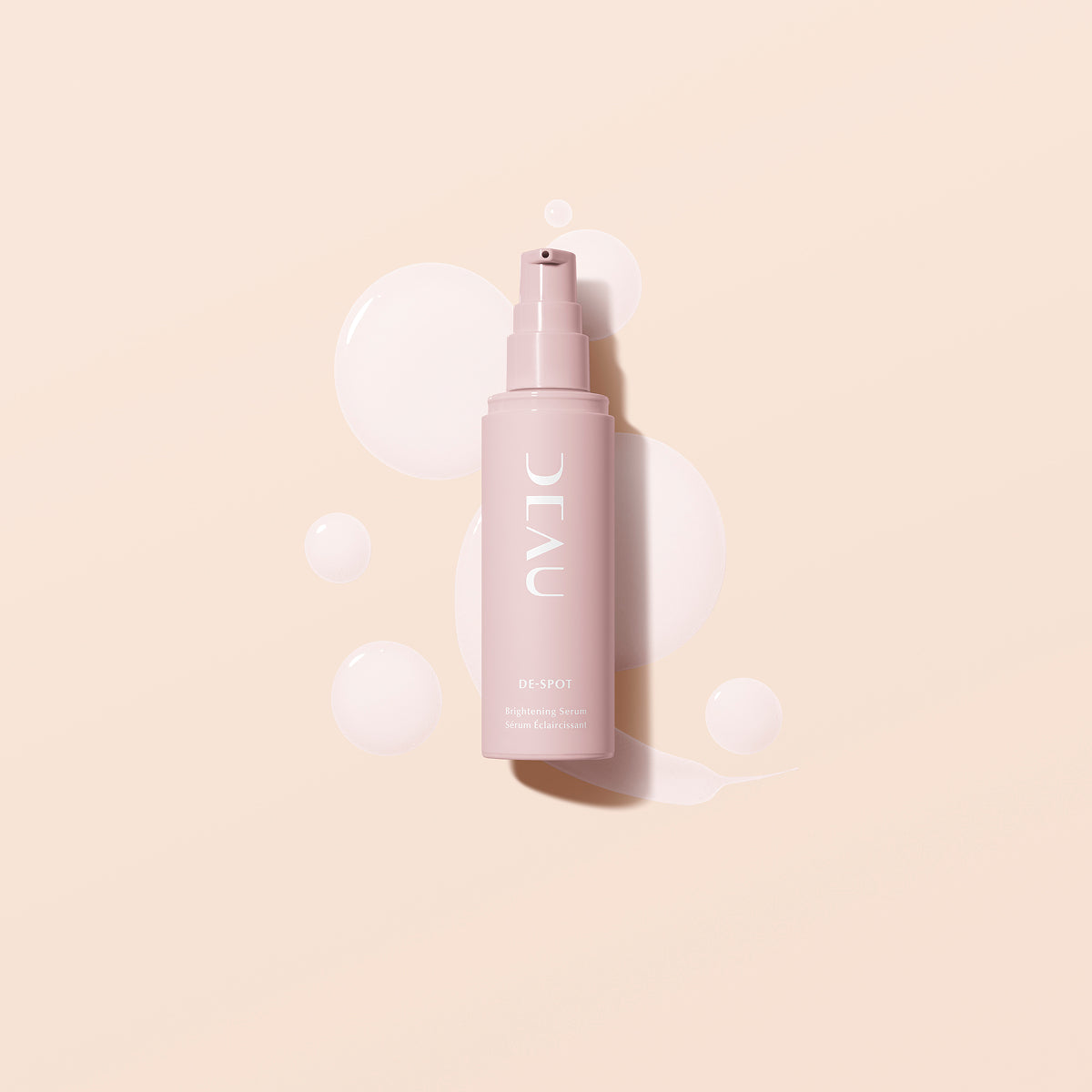 Pink skincare bottle labeled 'DEAU' on a beige background