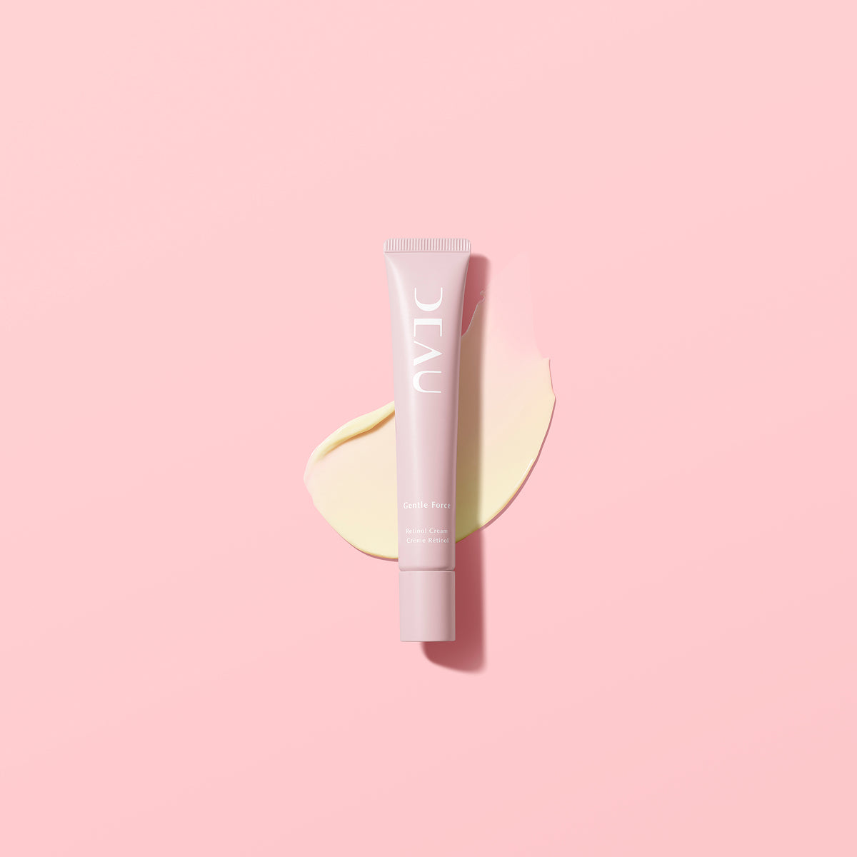 Cosmetic tube labeled 'DEAU' on a pink background