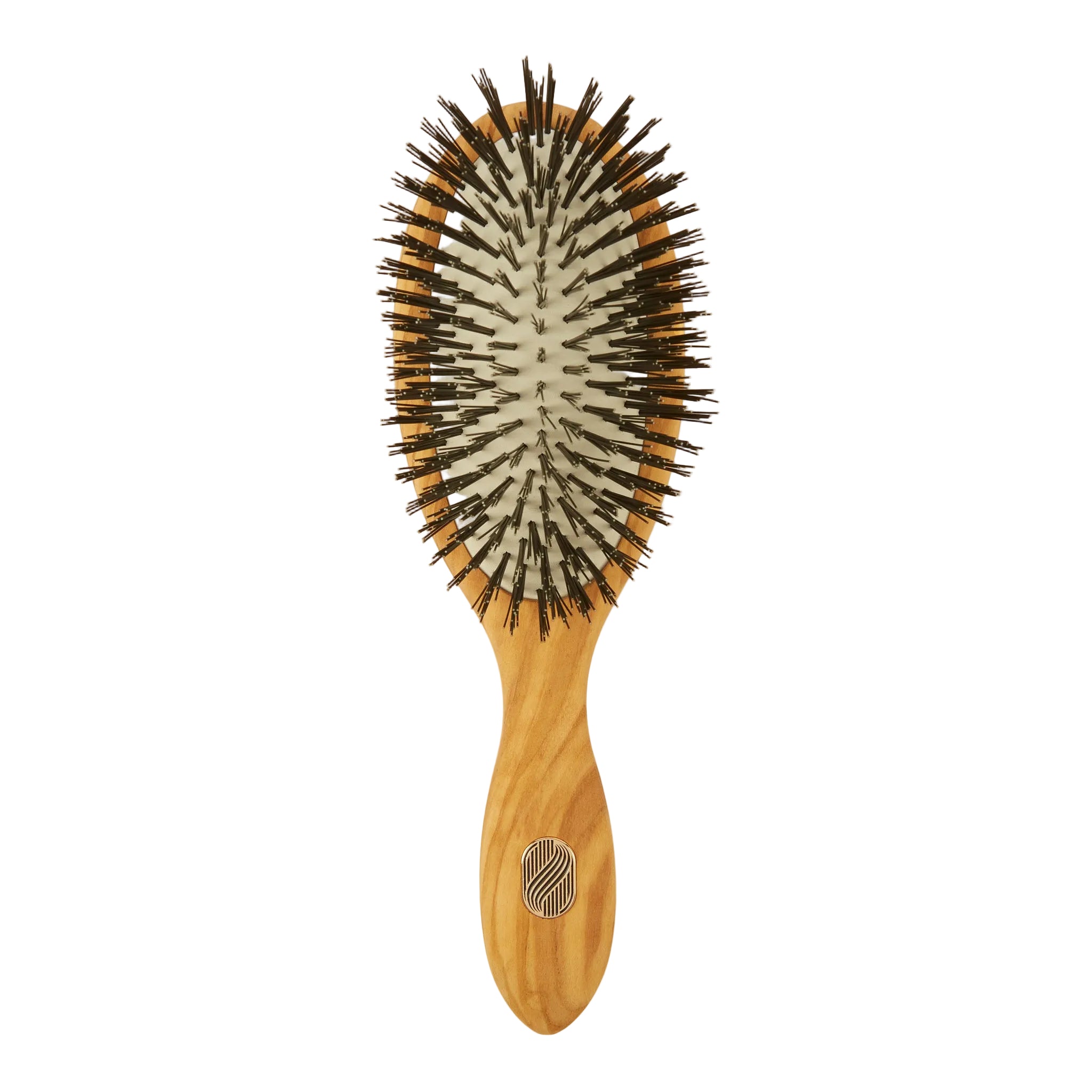An oval-shaped hairbrush with a light natural wood handle and backplate, black bristles, and a small circular metal logo on the handle, shown against a plain off-white background.