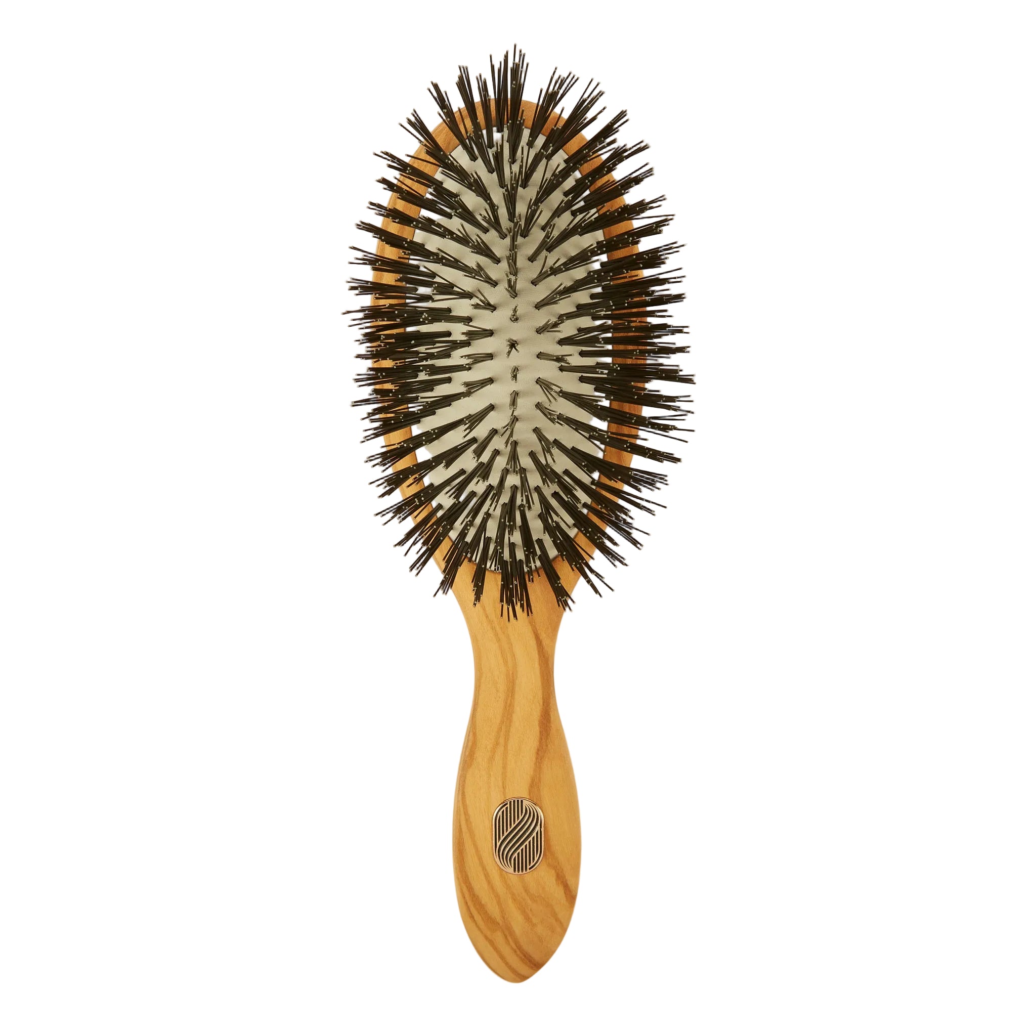 An oval-shaped hairbrush with a light natural wood handle and dark brown to black bristles, shown against a plain off-white background.