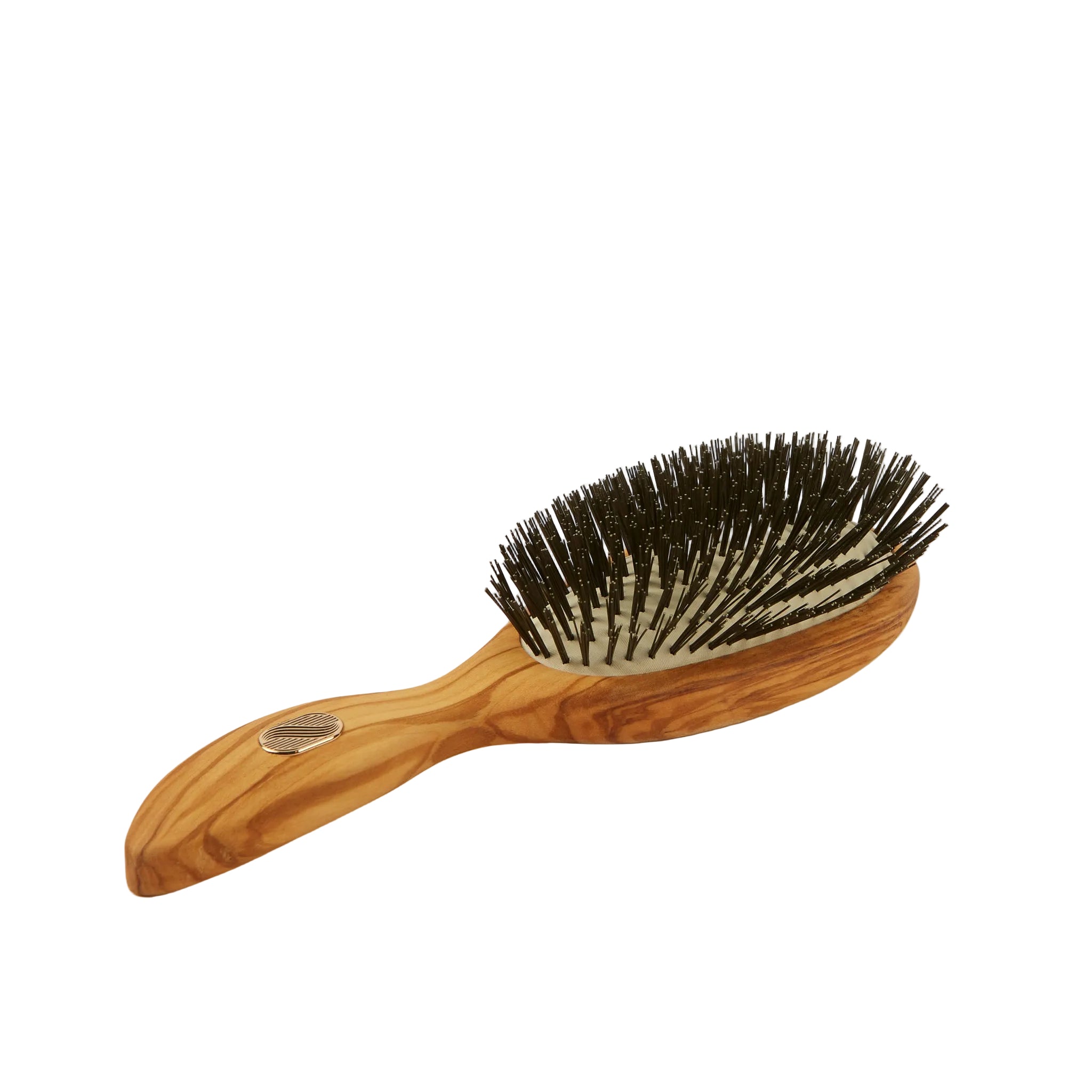 An oval-shaped hairbrush with a light brown and tan wood grain handle and dark brown to black bristles, shown on a plain off-white background.