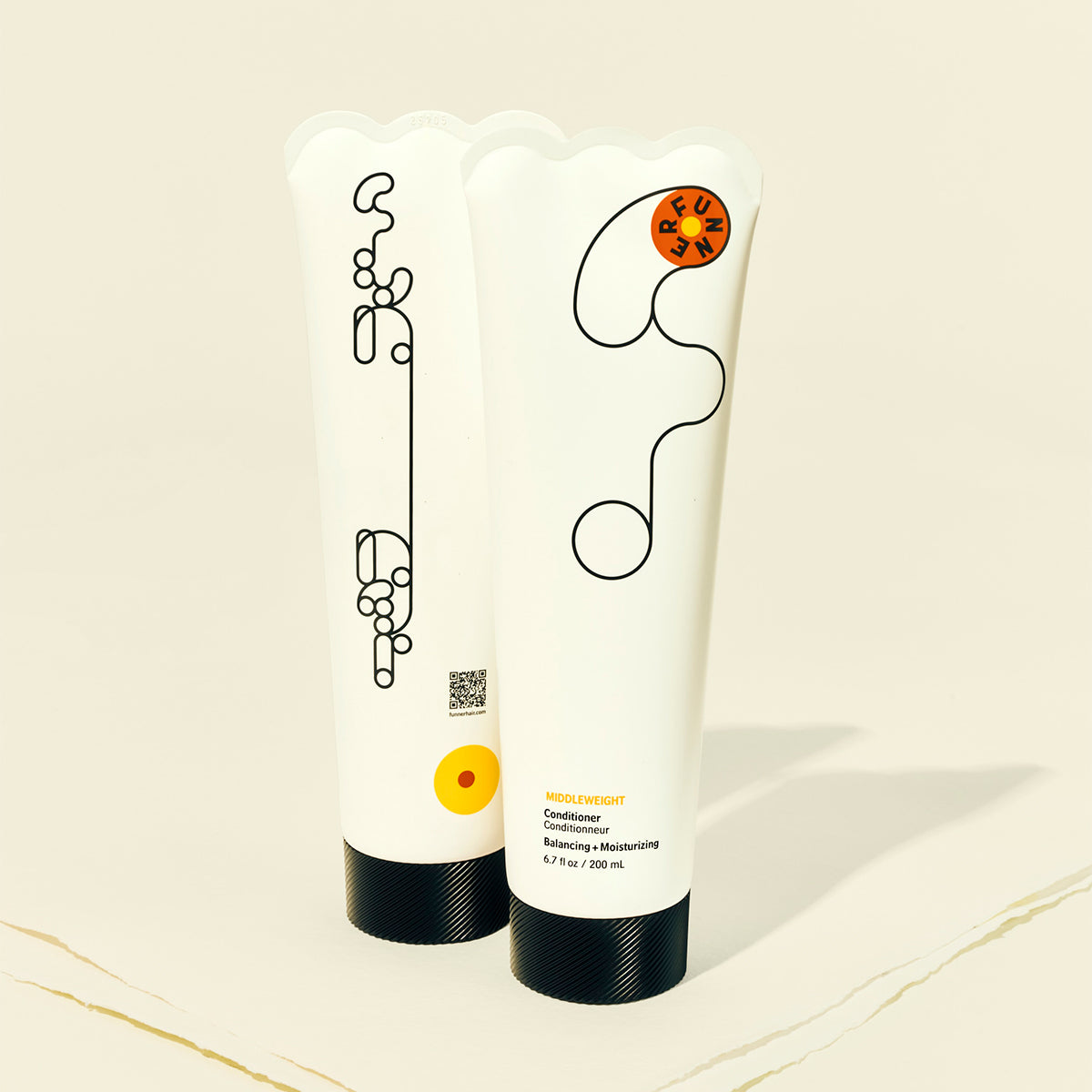 Two white conditioner bottles with black caps and decorative elements on a light background