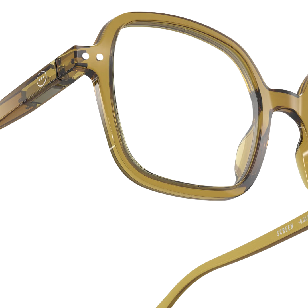Close-up of a pair of eyeglasses with a gold frame on a white background