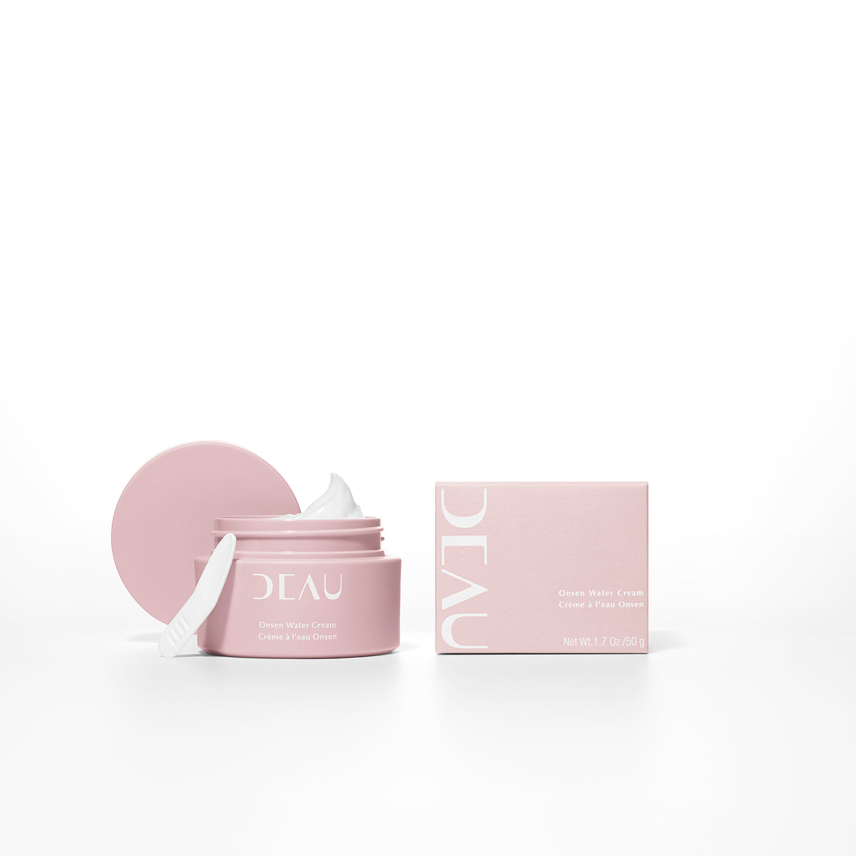 Pink skincare product jar with lid and box on a white background