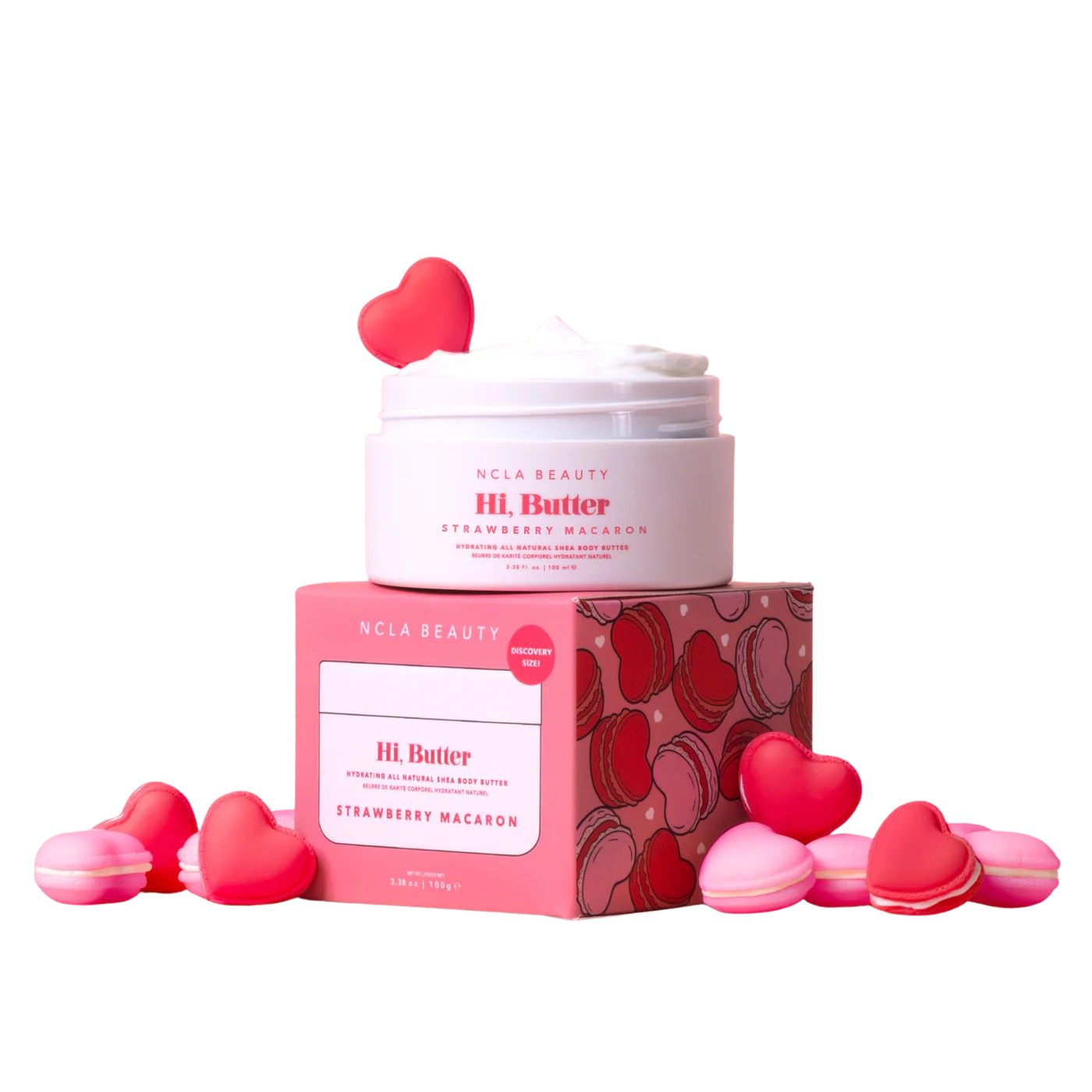 NCLA Beauty HI Butter with strawberry macaron packaging and heart-shaped candies on a white background