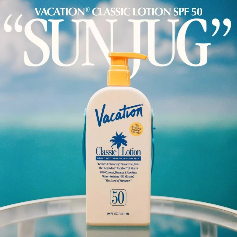 Vacation Classic Lotion SPF 50 bottle with a blue sky background