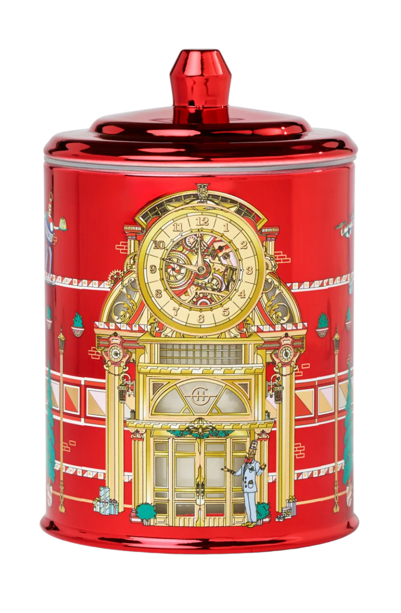 Decorative red canister with gold clock design on a white background
