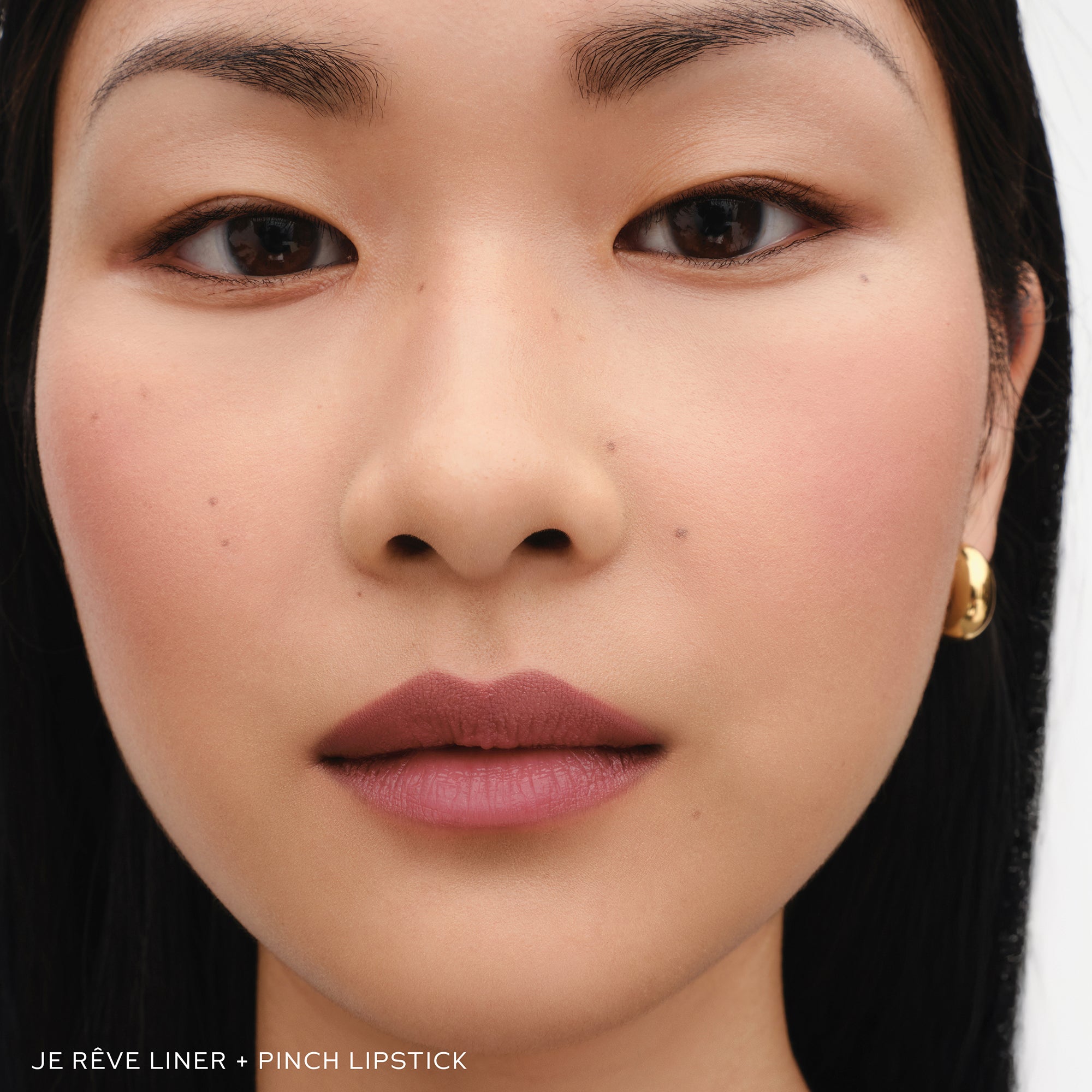 Closeup of woman wearing Westman Atelier Je Reve Lip Liner.