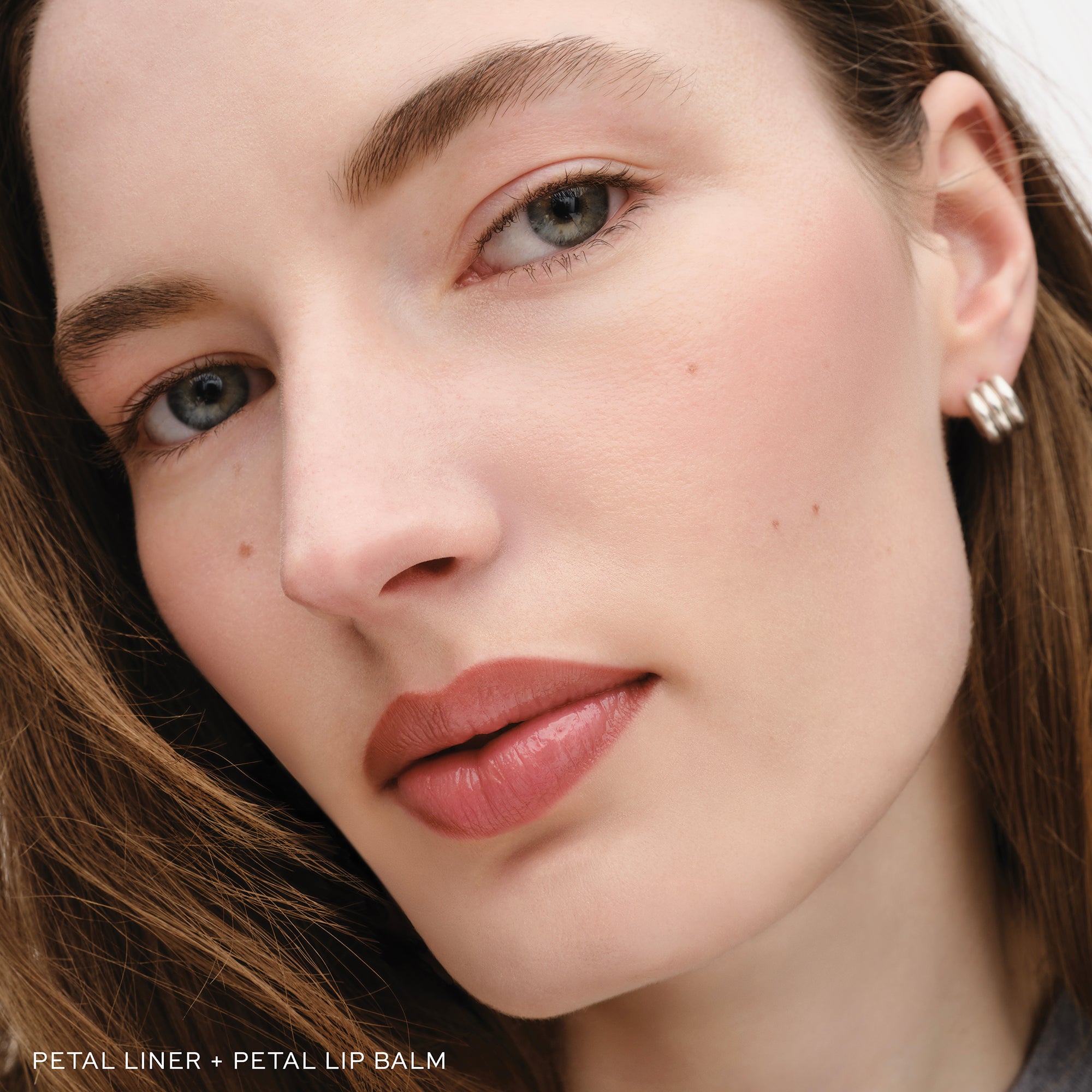 Woman wearing Westman Atelier Petal Lip Liner 