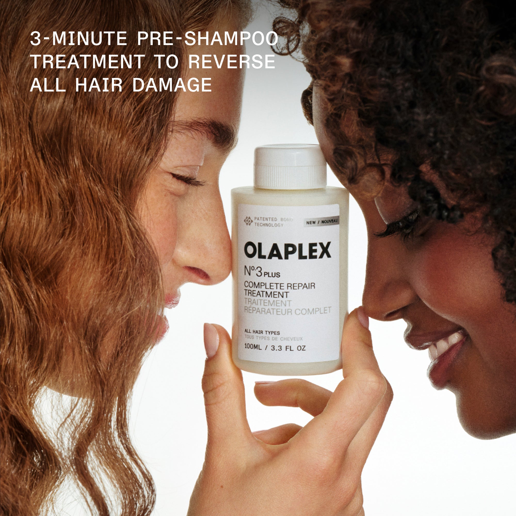 Olaplex hair treatment bottle held by two people with promotional text.