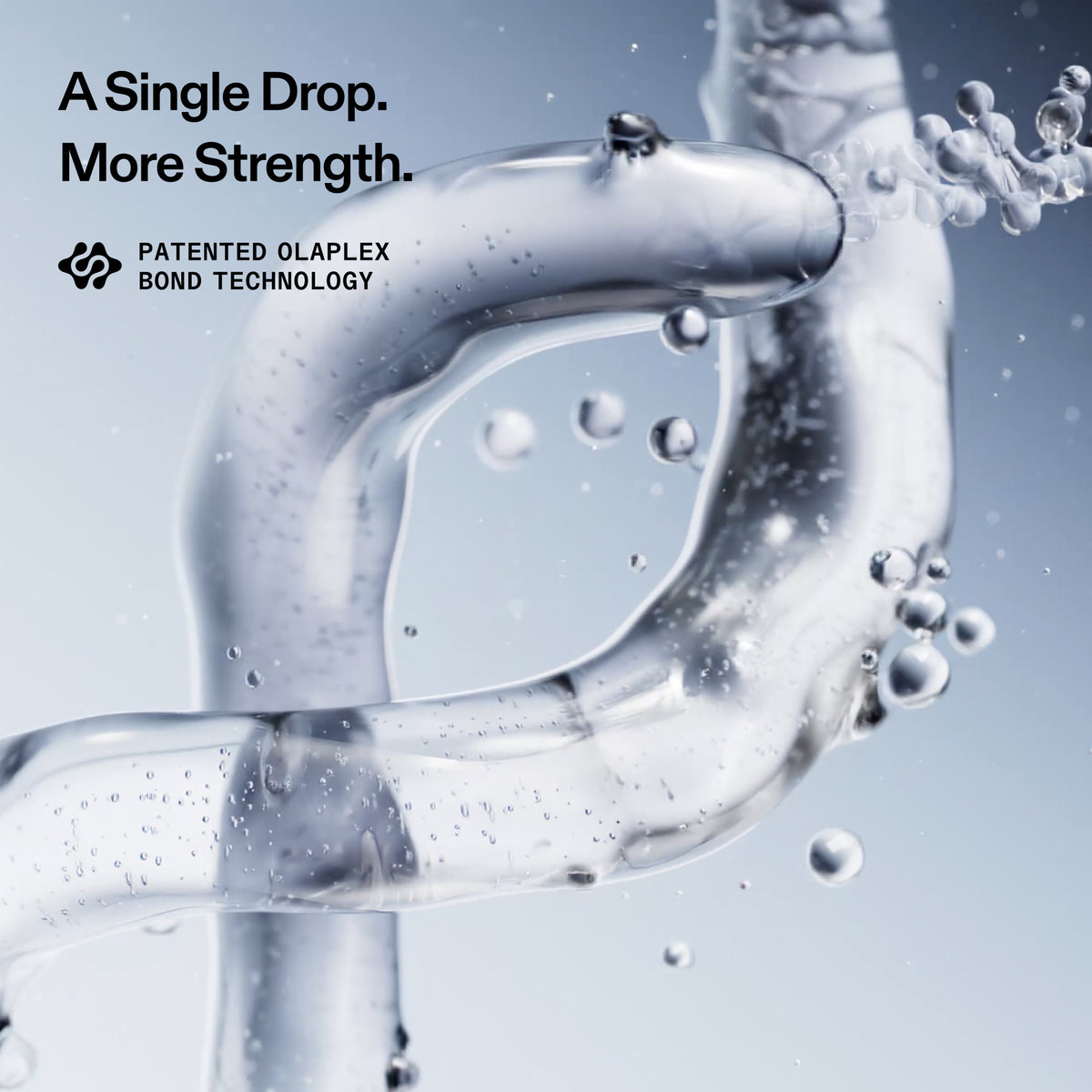 A close-up of clear liquid droplets and bubbles forming a loop against a pale blue-gray background, with the text 'A Single Drop. More Strength.