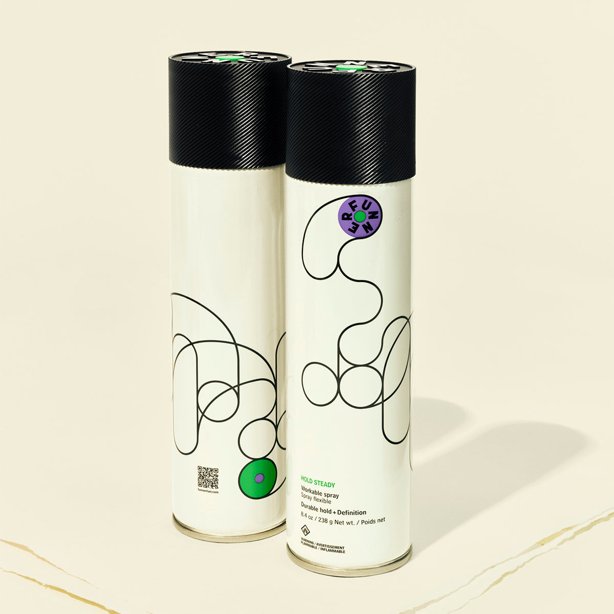 Two cylindrical products with black lids on a beige background