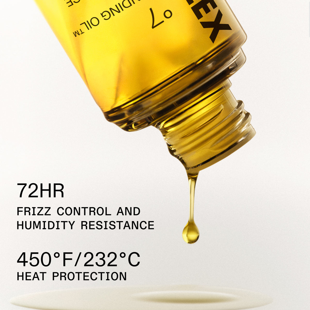 A close-up of a clear bottle pouring golden-yellow hair oil, with a single drop dripping below. Text on the image reads '72HR FRIZZ CONTROL AND HUMIDITY RESISTANCE' and '450°F/232°C HEAT PROTECTION'.