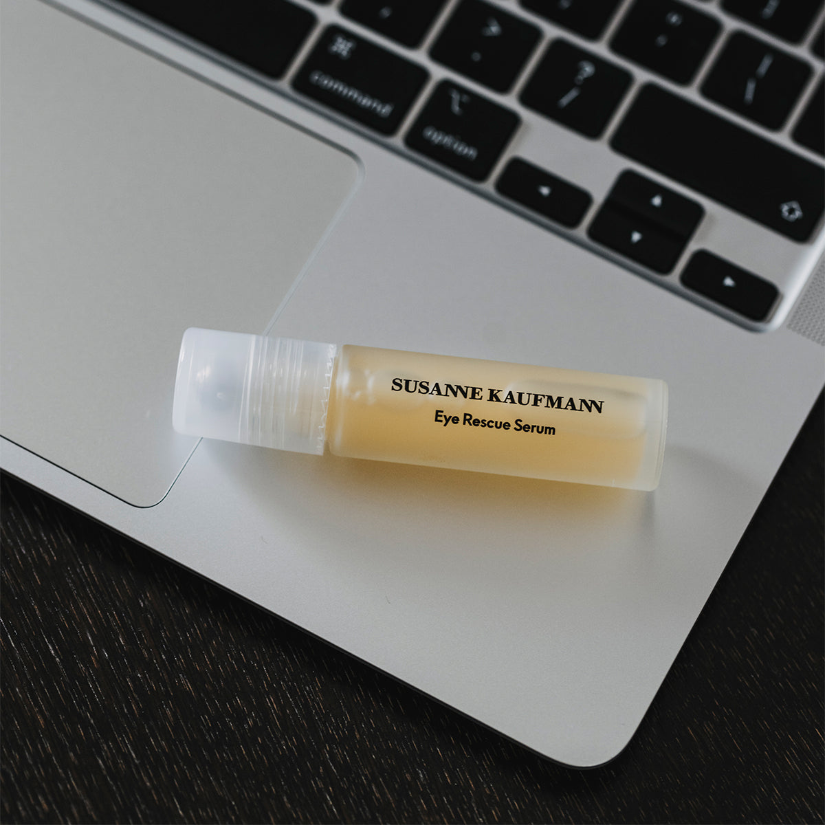 Susanne Kaufmann Eye Rescue Serum tube on a laptop
