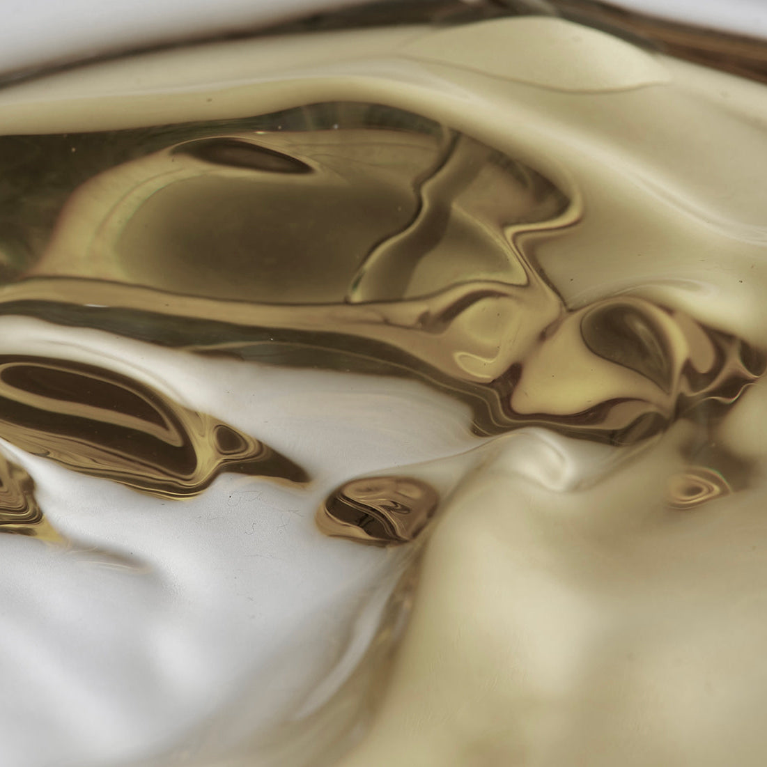 Close-up of marbled gold and white surface