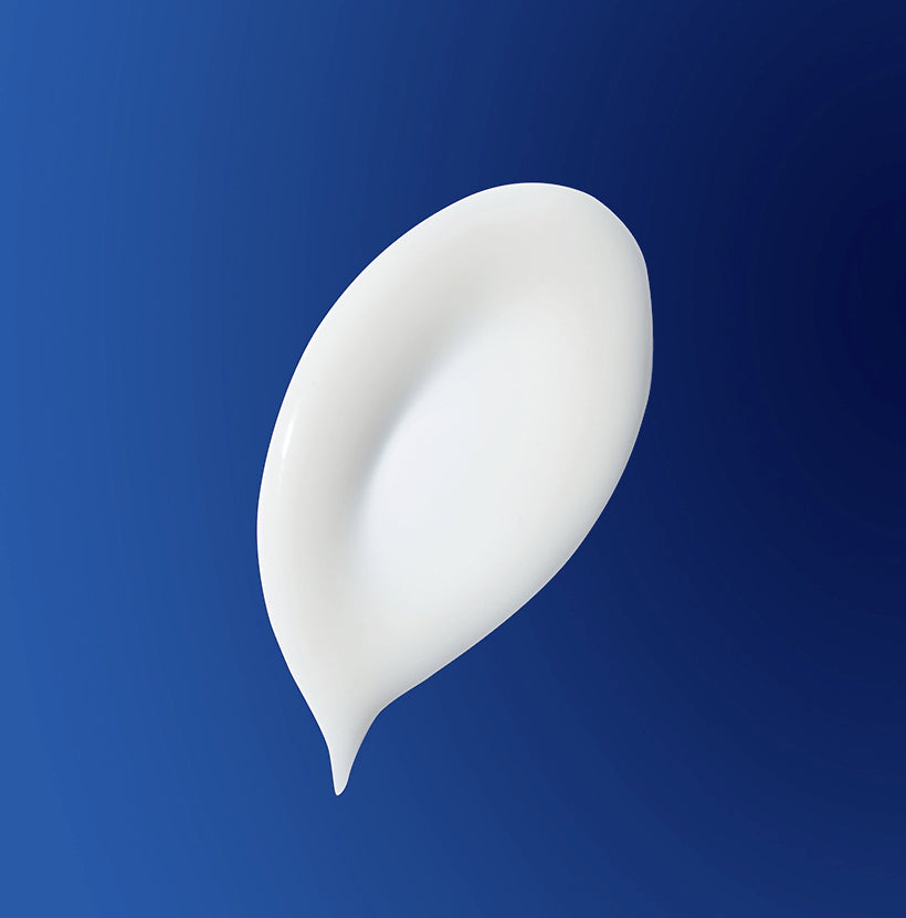 White cream smear on a blue background