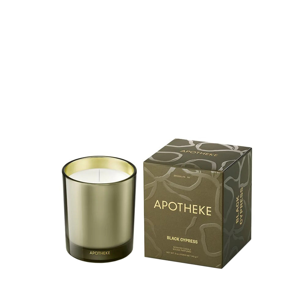 Apotheke candle with gold lid and matching packaging on a white background