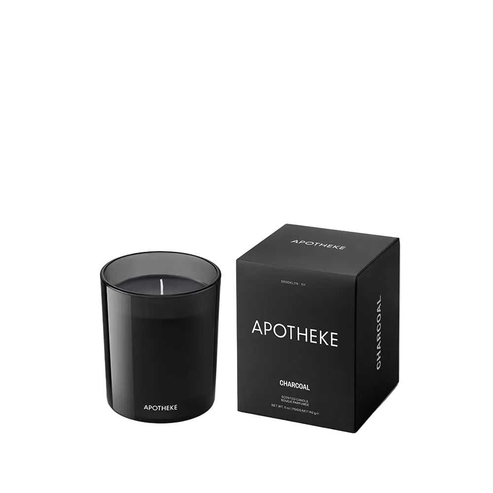 Charcoal candle and packaging with 'Apotheke' branding on a white background
