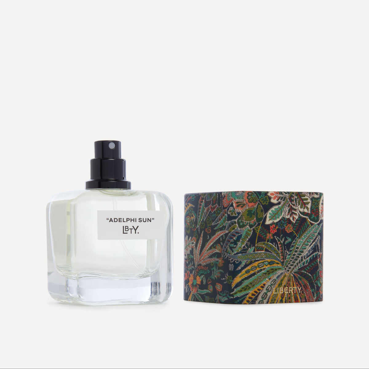 Perfume bottle with a patterned box on a white background