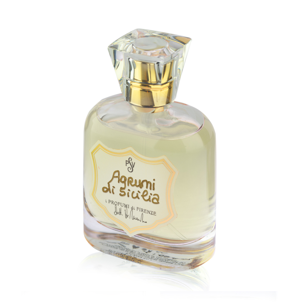 A clear glass perfume bottle with pale yellow liquid, a faceted clear cap, and a cream label reading 'Agrumi di Sicilia' on a white background.