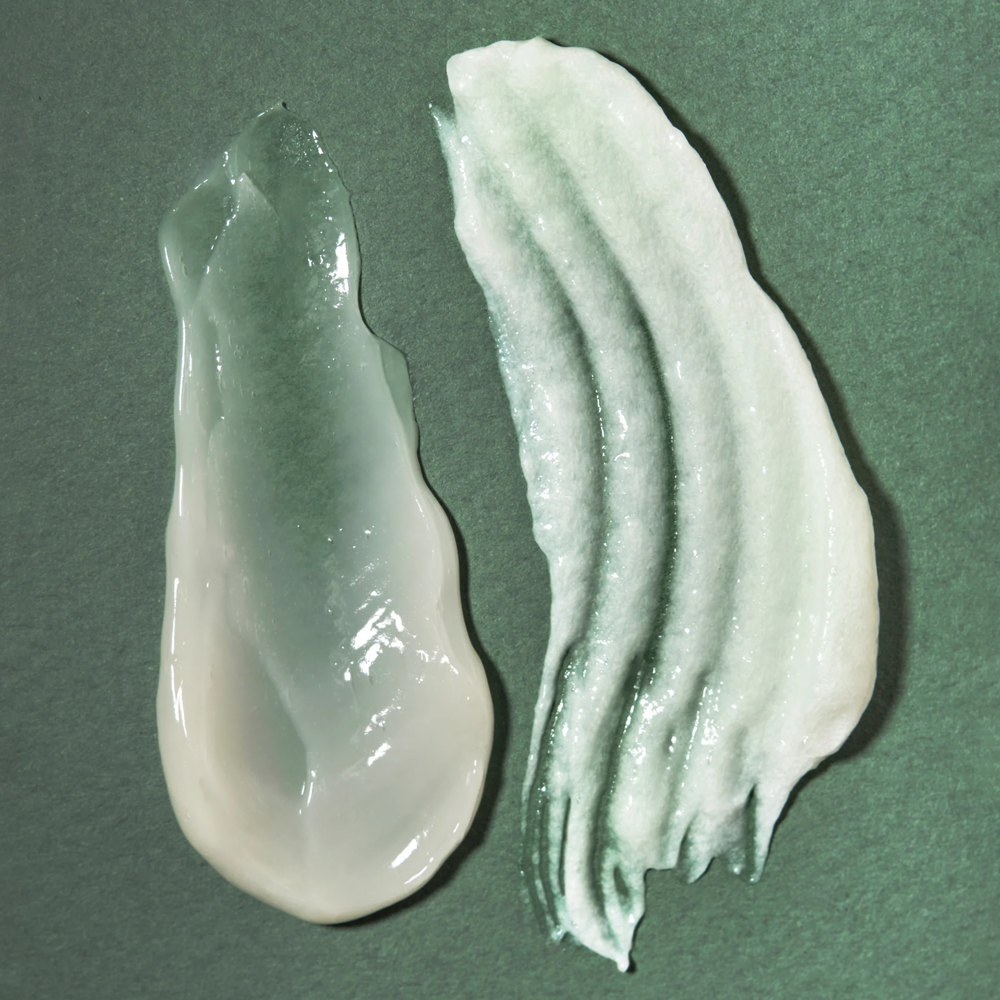 Smears of Rahua Aloe Vera Shampoo on a green surface