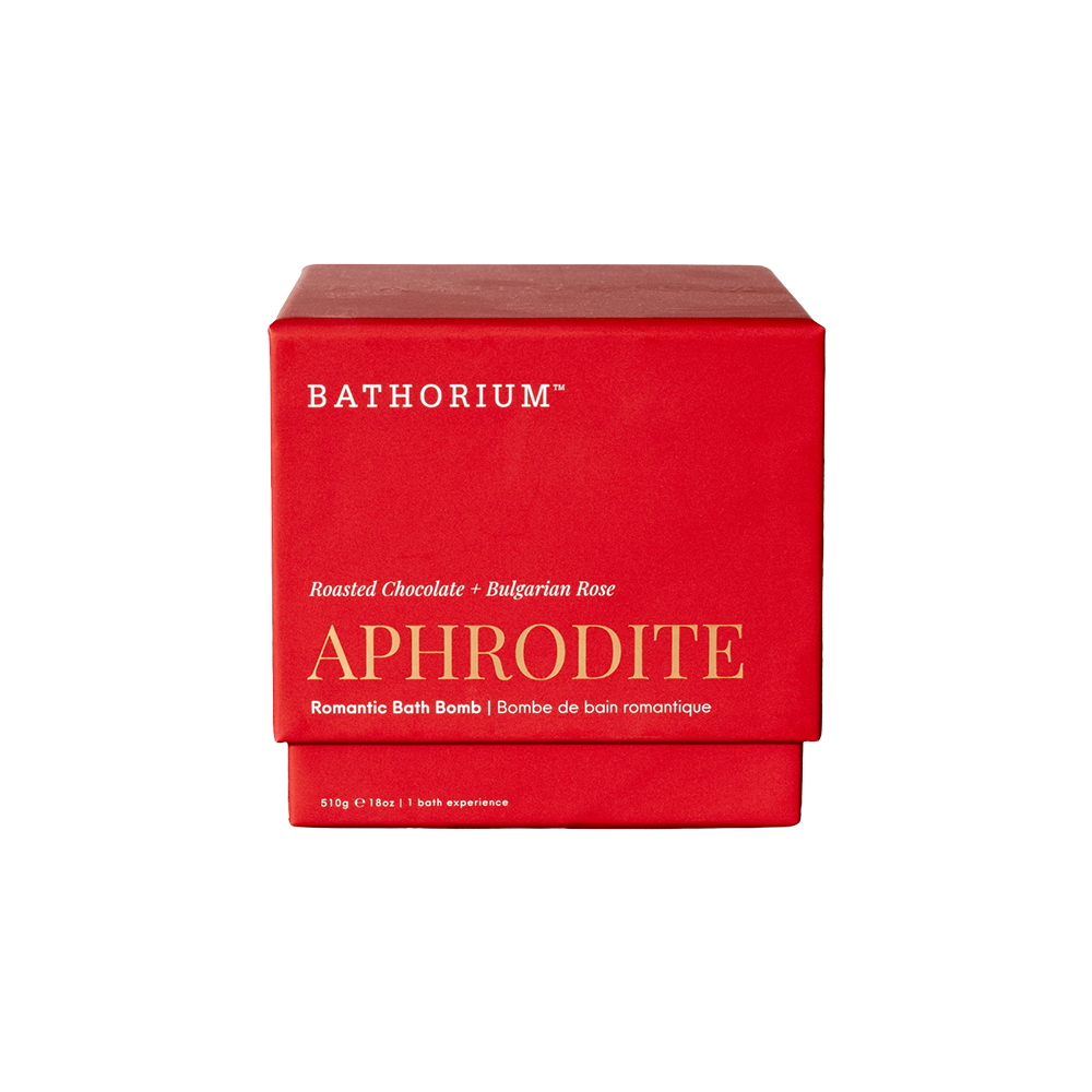 A red rectangular bath bomb box with white and gold text reading BATHORIUM and APHRODITE, photographed on a plain white background.