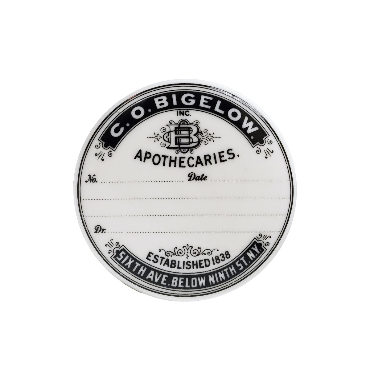 A round white label or sticker with black vintage-style typography reading 'C. O. Bigelow Apothecaries'