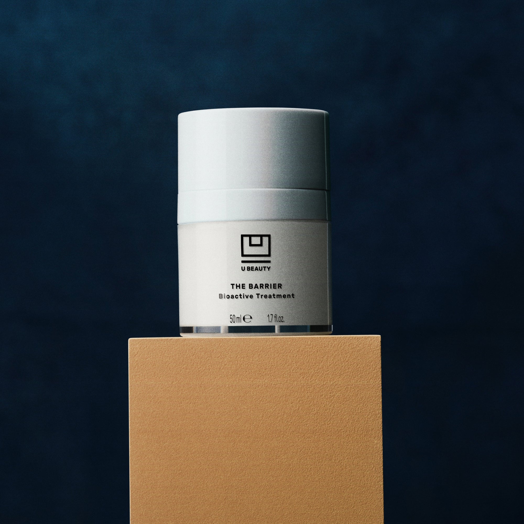 U Beauty's The BARRIER Bioactive Treatment on a pedestal.